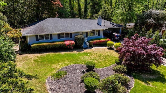4519 Sims Ct, Tucker, GA 30084 - ranch-style home with a front lawn, a chimney, and a forest view