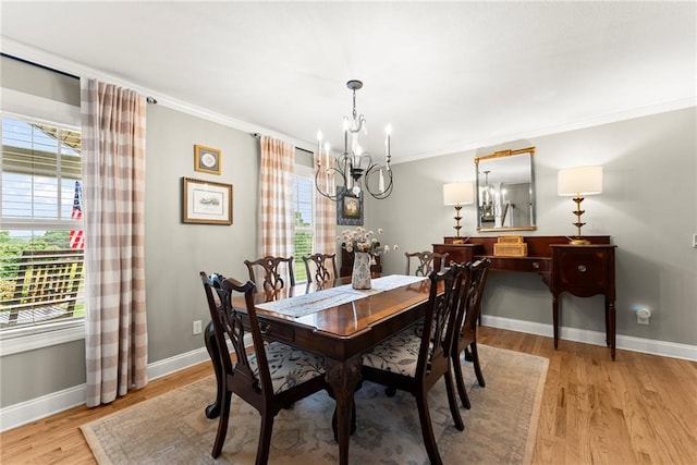 322 Windy Ridge Dr, Demorest, GA 30535 - dining space with a chandelier, plenty of natural light, light wood-style flooring, and crown molding