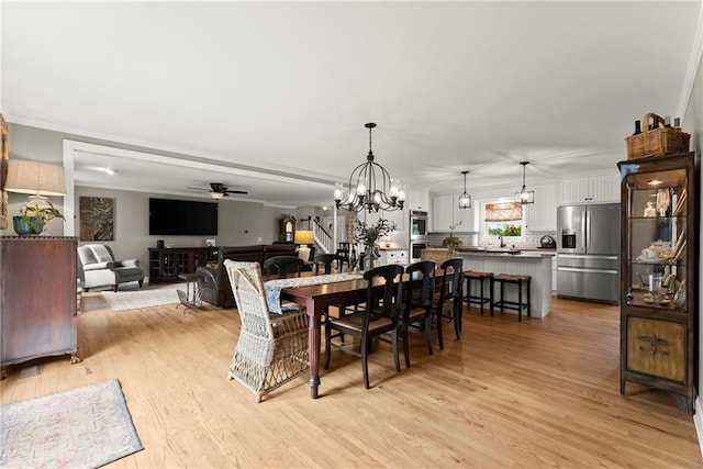 322 Windy Ridge Dr, Demorest, GA 30535 - dining room with ceiling fan, light wood finished floors, and a chandelier