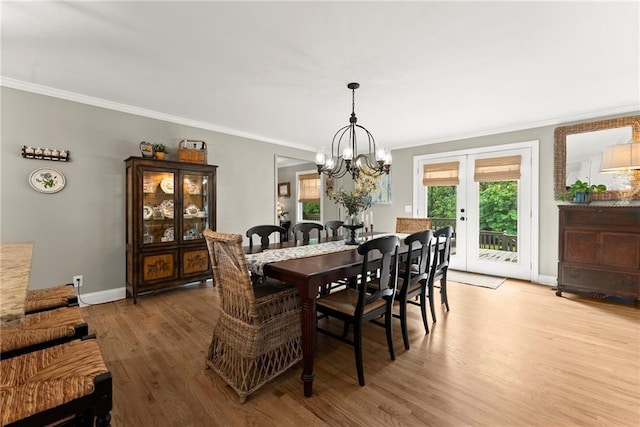 322 Windy Ridge Dr, Demorest, GA 30535 - dining area with ornamental molding, light wood-type flooring, a chandelier, and french doors