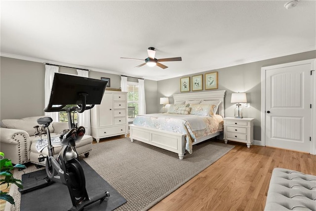 322 Windy Ridge Dr, Demorest, GA 30535 - bedroom with crown molding, light wood finished floors, and ceiling fan