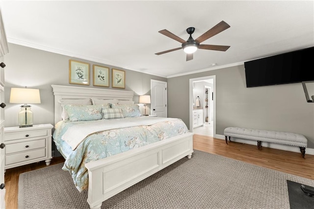 322 Windy Ridge Dr, Demorest, GA 30535 - bedroom with dark wood-style floors, ornamental molding, ceiling fan, and ensuite bathroom