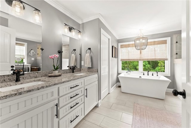 322 Windy Ridge Dr, Demorest, GA 30535 - full bathroom with double vanity, a freestanding bath, a chandelier, and ornamental molding