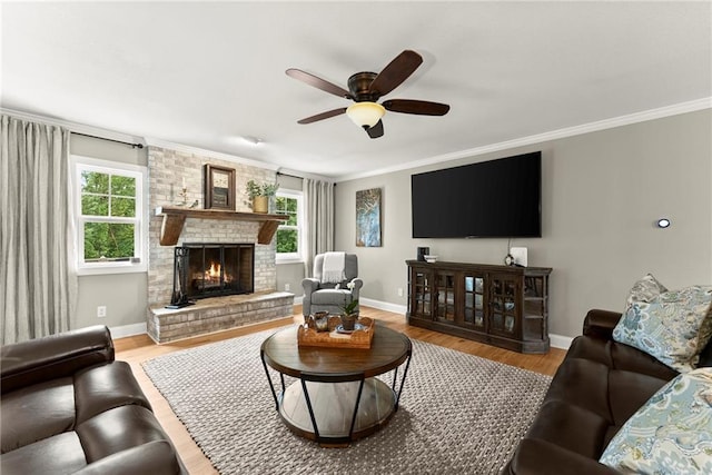 322 Windy Ridge Dr, Demorest, GA 30535 - living area with a brick fireplace, crown molding, wood finished floors, and ceiling fan