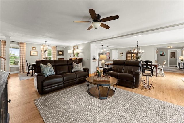 322 Windy Ridge Dr, Demorest, GA 30535 - living room with a chandelier, light wood-style flooring, ceiling fan, and crown molding