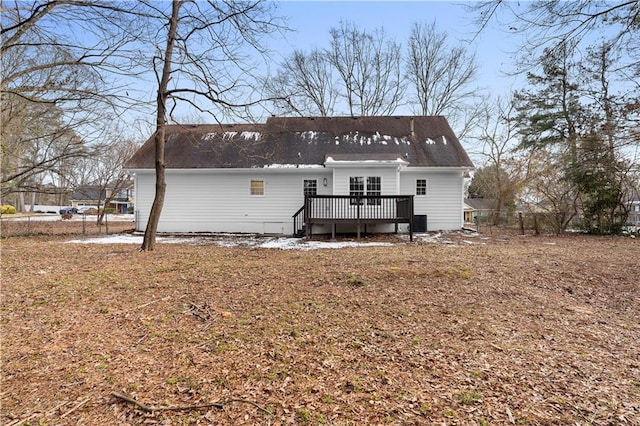 rear view of property with a wooden deck