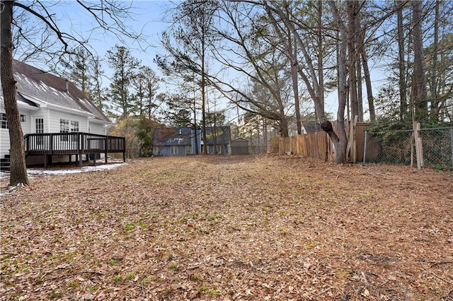 view of yard featuring a wooden deck