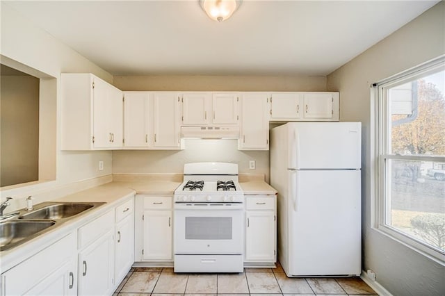 kitchen featuring white cabinetry, sink, white appliances, and light tile patterned flooring