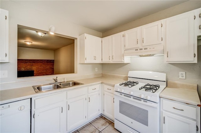 kitchen with white cabinetry, sink, white appliances, and light tile patterned floors