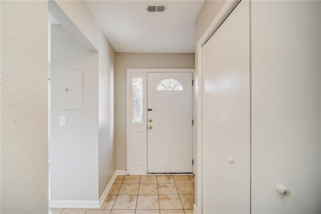 entryway featuring light tile patterned floors