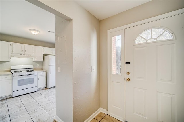 entryway with light tile patterned floors