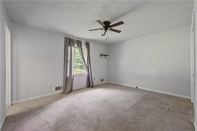 120 Lakeside Dr, Ellenwood, GA 30294 - empty room with a ceiling fan, a textured ceiling, and carpet