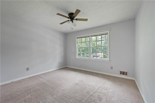 120 Lakeside Dr, Ellenwood, GA 30294 - spare room with a ceiling fan, carpet floors, and a textured ceiling