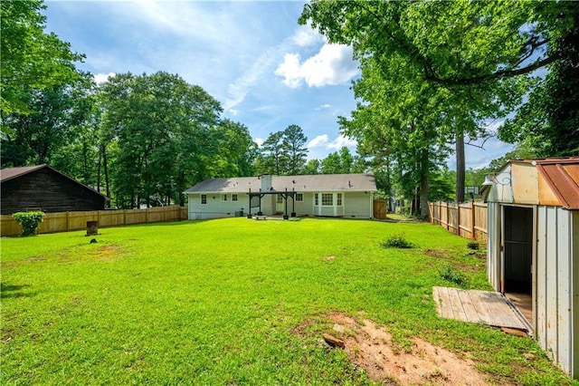120 Lakeside Dr, Ellenwood, GA 30294 - fenced backyard featuring a storage unit