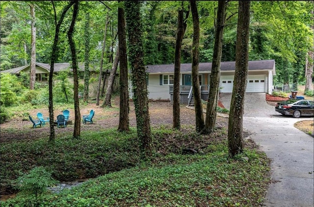 view of front of property with a garage and driveway