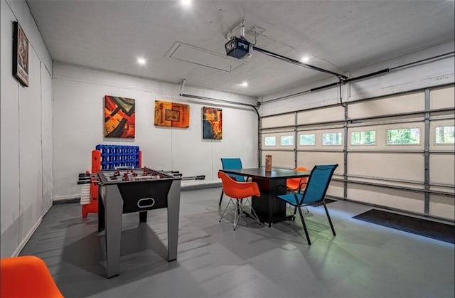 rec room featuring a garage, recessed lighting, and finished concrete floors