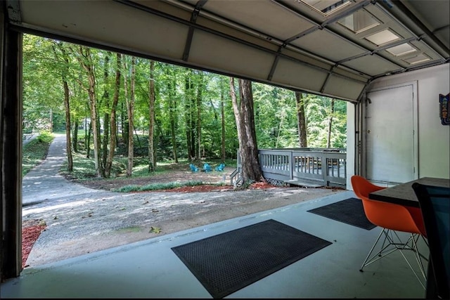 garage featuring a forest view