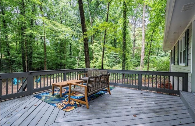 deck featuring a view of trees