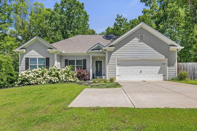 ranch-style house featuring a garage, driveway, a shingled roof, fence, and a front lawn