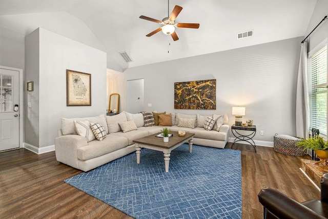 living room with high vaulted ceiling, visible vents, and wood finished floors