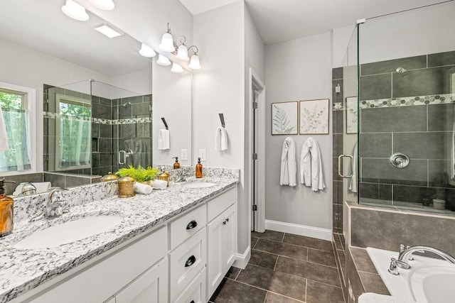 bathroom with a sink, a shower stall, a bath, and double vanity