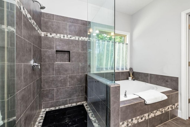 full bathroom featuring tiled shower and a garden tub