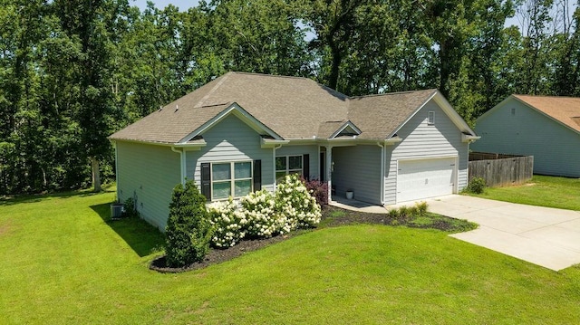 ranch-style house featuring concrete driveway, an attached garage, fence, central air condition unit, and a front lawn