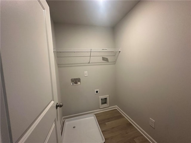 45 Emerald Ln, Covington, GA 30014 - laundry area with hookup for an electric dryer, dark wood-style floors, baseboards, and hookup for a washing machine