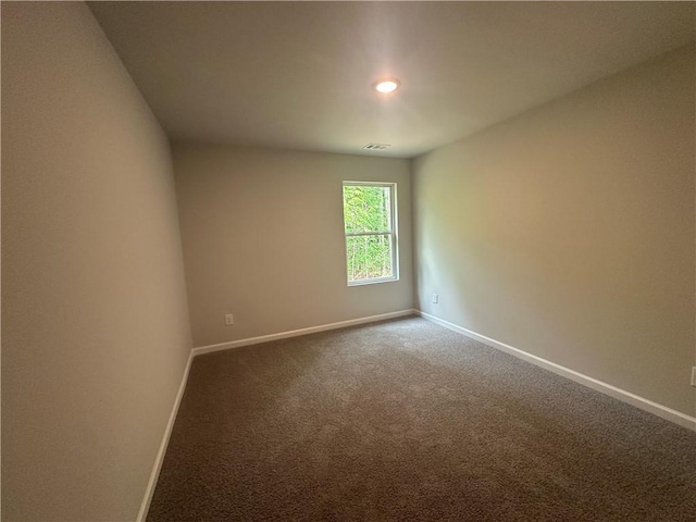 45 Emerald Ln, Covington, GA 30014 - carpeted empty room with baseboards and recessed lighting