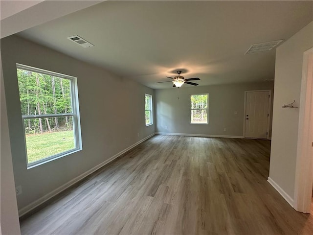 45 Emerald Ln, Covington, GA 30014 - spare room featuring baseboards, wood finished floors, and a ceiling fan