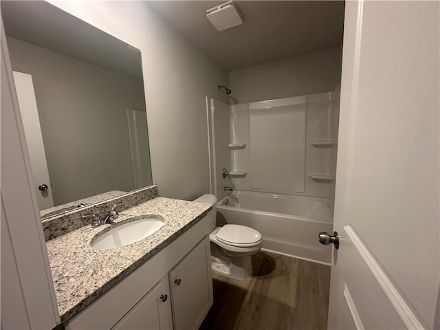 45 Emerald Ln, Covington, GA 30014 - bathroom with vanity, wood finished floors, toilet, and shower / bath combination