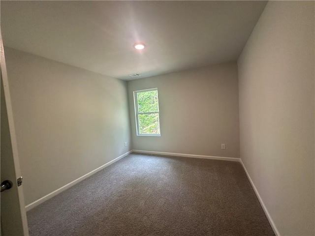45 Emerald Ln, Covington, GA 30014 - unfurnished room featuring baseboards, dark colored carpet, and recessed lighting