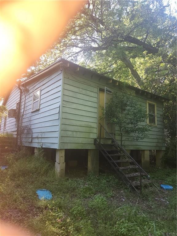 view of home's exterior with stairway