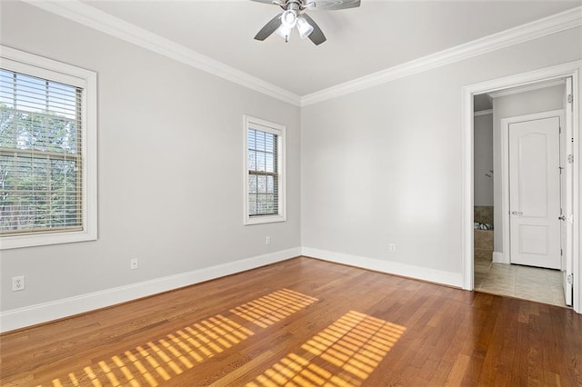 spare room featuring crown molding, ceiling fan, and hardwood / wood-style floors