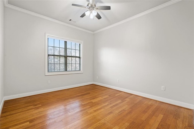 unfurnished room with ceiling fan, ornamental molding, and light wood-type flooring