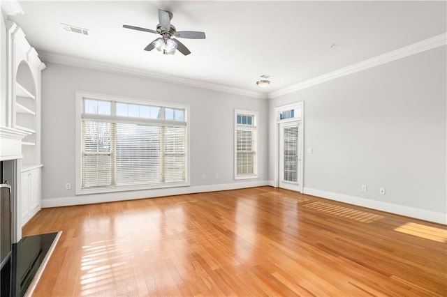 unfurnished living room with ceiling fan, ornamental molding, and light hardwood / wood-style floors