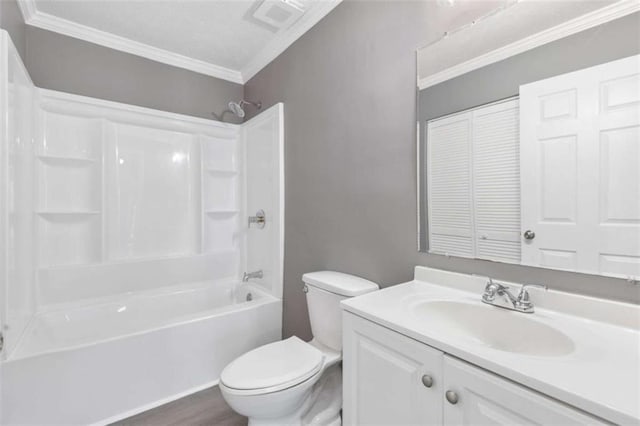 full bath featuring crown molding, toilet, shower / bathtub combination, wood finished floors, and vanity