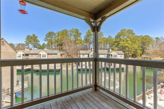 wooden terrace with a residential view