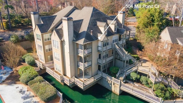 birds eye view of property with a water view