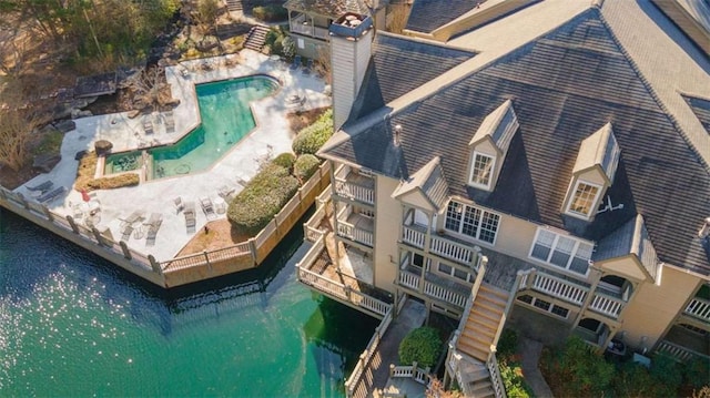 birds eye view of property with a water view