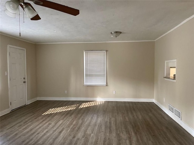 unfurnished room featuring ceiling fan, dark hardwood / wood-style floors, and ornamental molding