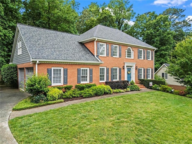 4792 Fairville Ct, Marietta, GA 30062 - view of front facade with a shingled roof, brick siding, concrete driveway, and a front lawn