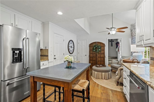 4792 Fairville Ct, Marietta, GA 30062 - kitchen with appliances with stainless steel finishes, ceiling fan, light wood-type flooring, white cabinets, and recessed lighting