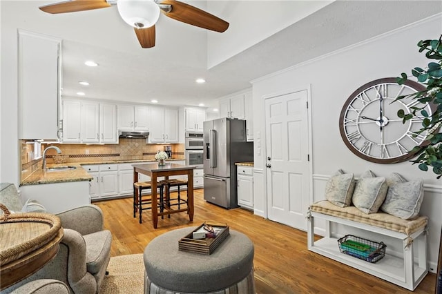 4792 Fairville Ct, Marietta, GA 30062 - living area featuring recessed lighting, light wood-type flooring, a ceiling fan, and ornamental molding