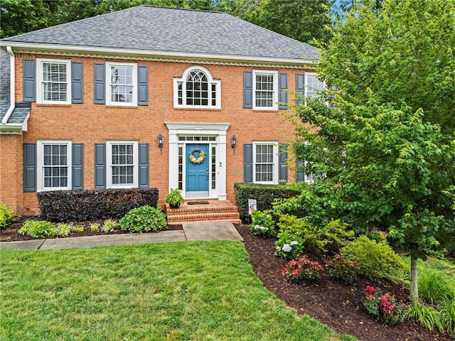 4792 Fairville Ct, Marietta, GA 30062 - colonial home featuring brick siding, a front yard, and roof with shingles