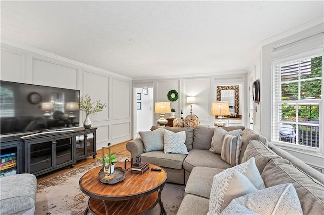 4792 Fairville Ct, Marietta, GA 30062 - living room featuring a decorative wall, crown molding, and wood finished floors