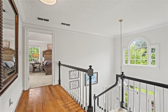 4792 Fairville Ct, Marietta, GA 30062 - corridor featuring an upstairs landing, light wood-style flooring, and crown molding