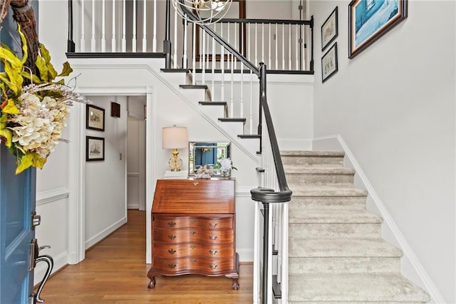 4792 Fairville Ct, Marietta, GA 30062 - stairs featuring wood finished floors, baseboards, and a high ceiling