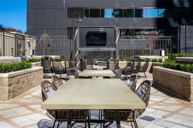 view of patio with a fireplace