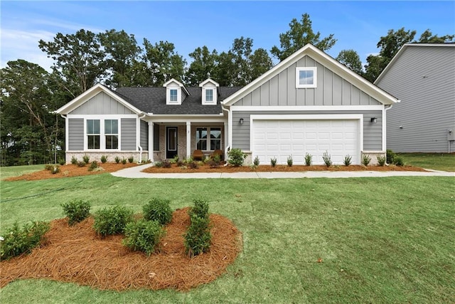 craftsman-style house with a garage and a front yard